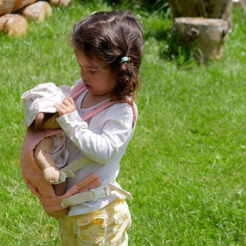 A qulited rose Olli Ella Doll Carrier with padded straps designed for carrying dolls.